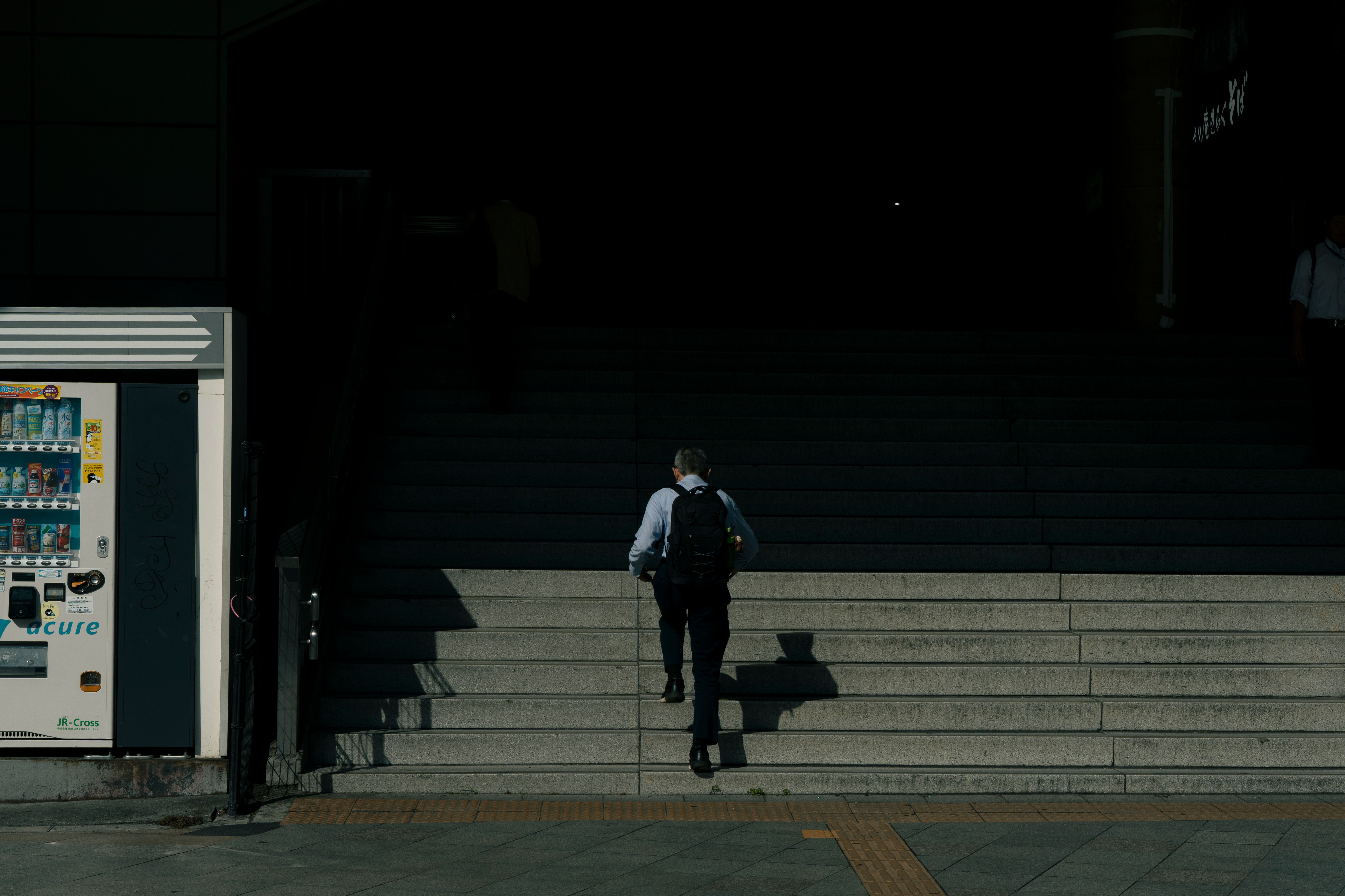 man sprinting on to the train